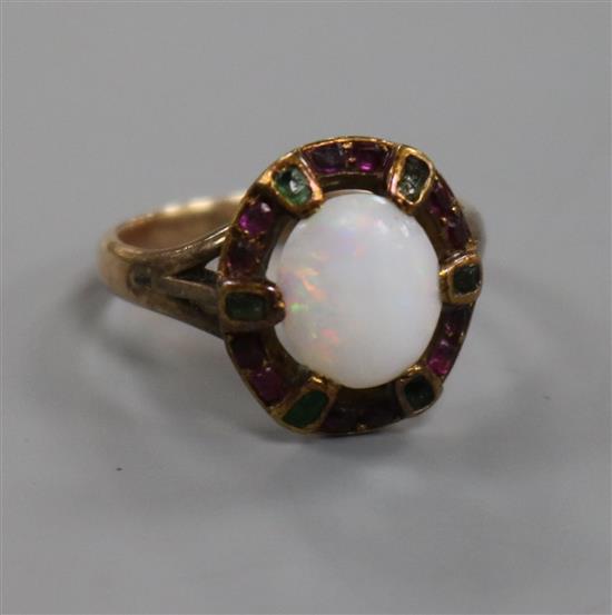 An early 20th century yellow metal, white opal and gem set ring in the suffragette colours, size N.